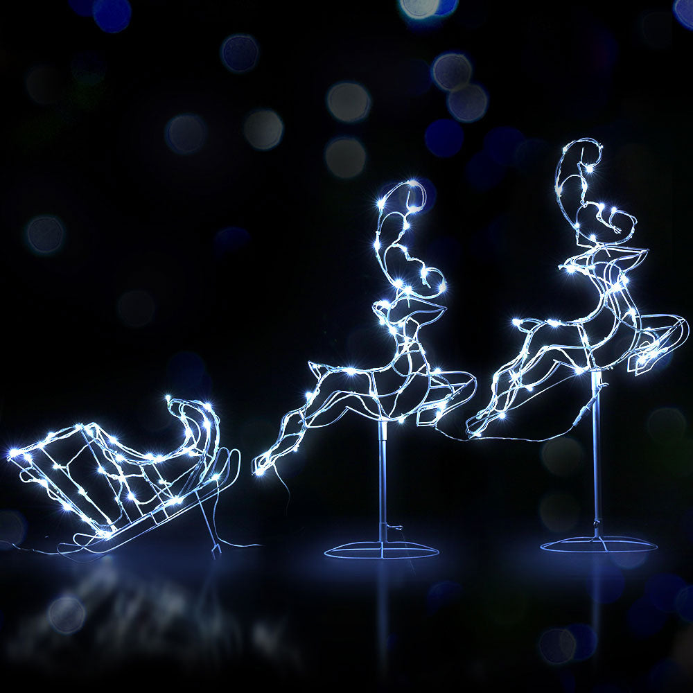 A beautiful LED rope light display featuring two reindeer pulling a sleigh, set in a sturdy white metal frame, perfect for Christmas decorations.